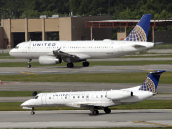 Two United Airlines planes taking off at George Bush Intercontinental Airport in Houston. After a man was dragged off a United flight, the company changed its policy on overbooked flights.