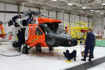 Every couple hundred hours a team of Air Station technicians conduct a complete maintenance check on the Jayhawk helicopters. (Photo by Emily Russell/KCAW)