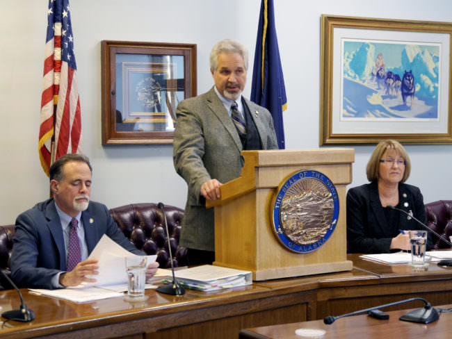 Senate President Pete Kelly, R-Fairbanks, talks to reporters at a Senate Majority press availability, April 13, 2017. Sens. Peter Micciche, R- Soldotna and Anna Mackinnon, R-Anchorage, seated next to him also participated. (Photo by Skip Gray/360 North)