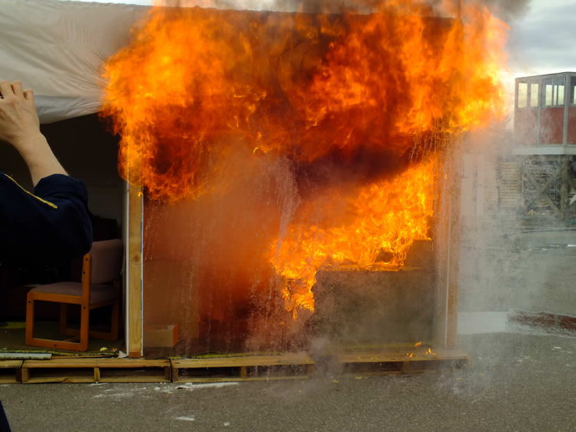 Gases inside a burning room can sometimes reach 1200 degrees, creating an explosive flashover. This was an intentionally started fire that was part of a training exercise at Juneau’s Hagevig Regional Fire Training Center. (Photo by Matt Miller/KTOO)