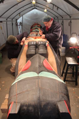 Herb Sheakley, left, and Mick Beasley right work on the healing Raven totem.