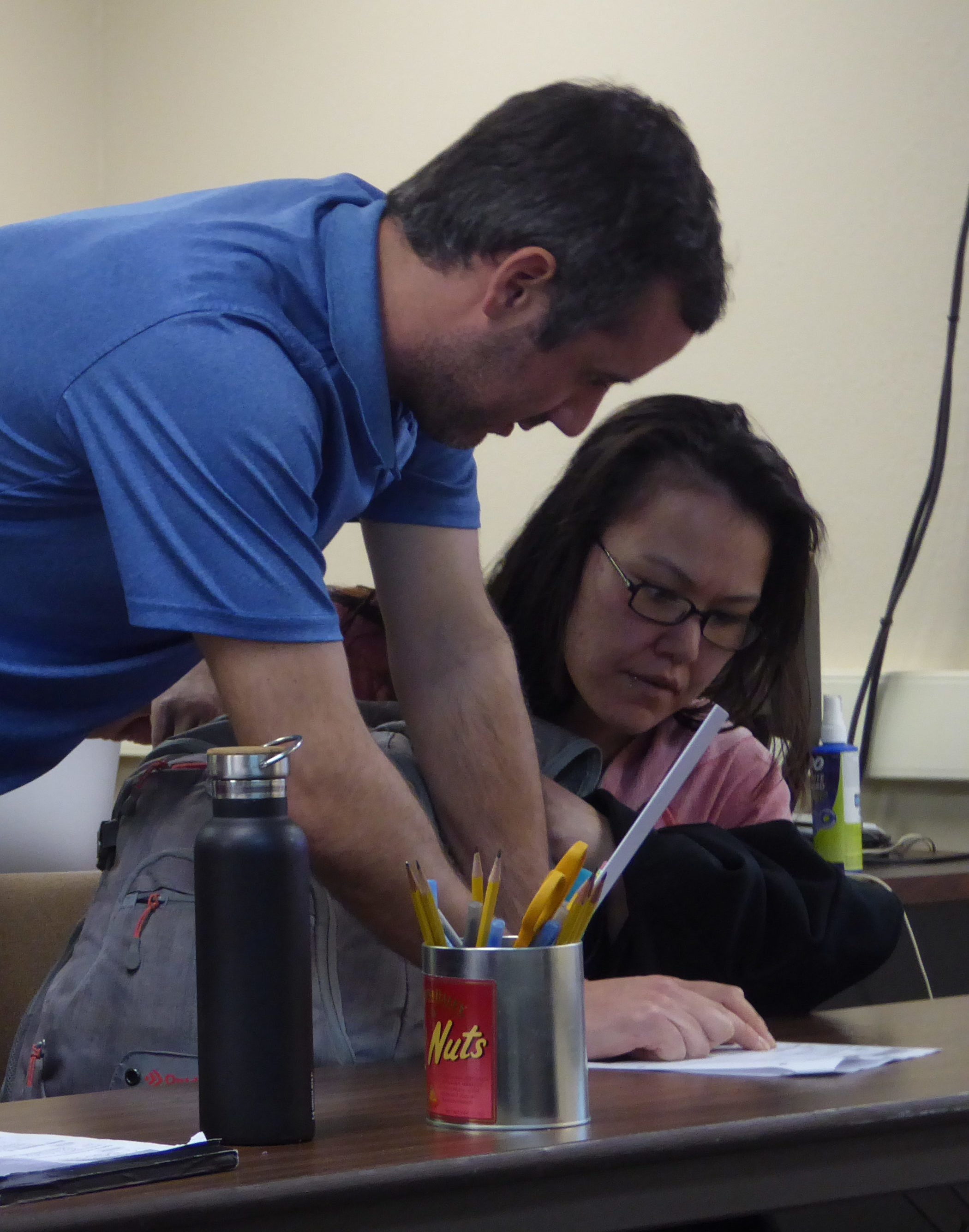 Jeff Smith, middle, helps a student during his math class on Tuesday, May 2, 2017.