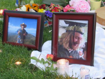 Mourners lit candles and incense and laid flowers before photos of Taliesin Myrddin Namkai Meche of Ashland, Oregon. Namkai Meche died Friday while trying to defend some young women on a train in Portland.
