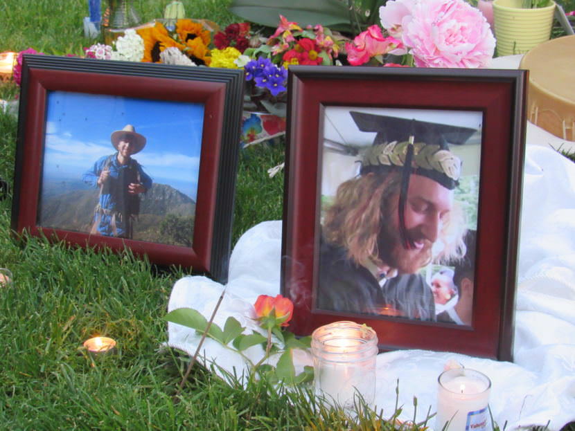 Mourners lit candles and incense and laid flowers before photos of Taliesin Myrddin Namkai Meche of Ashland, Oregon. Namkai Meche died Friday while trying to defend some young women on a train in Portland.