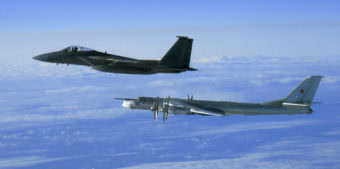 An F-15 Eagle from the 12th Fighter Squadron at Elmendorf Air Force Base, Alaska, flies next to a Russian Tu-95 Bear Bomber on Sept. 28, 2006, during a Russian exercise near the west coast of Alaska.
