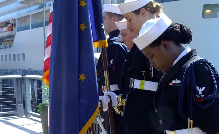 Members of the color guard from USS O’Kane bow their heads during reading of the benediction at Tuesday’s memorial service for USS Juneau.