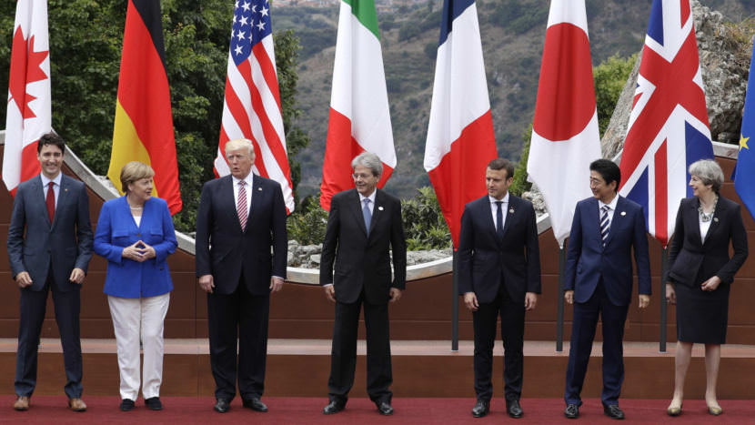 From left, Canadian Prime Minister Justin Trudeau, German Chancellor Angela Merkel, U.S. President Donald Trump, Italian Prime Minister Paolo Gentiloni, French President Emmanuel Macron, Japan's Prime Minister Shinzo Abe, and British Prime Minister Theresa May pose during the G7 summit in Taormina, Italy, on Friday.