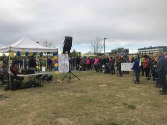 More than 100 people gathered in Anchorage’s Cuddy Midtown Park on Saturday, May 20, 2017 to urge lawmakers to preserve education funding. (Photo by Josh Edge/Alaska Public Media)