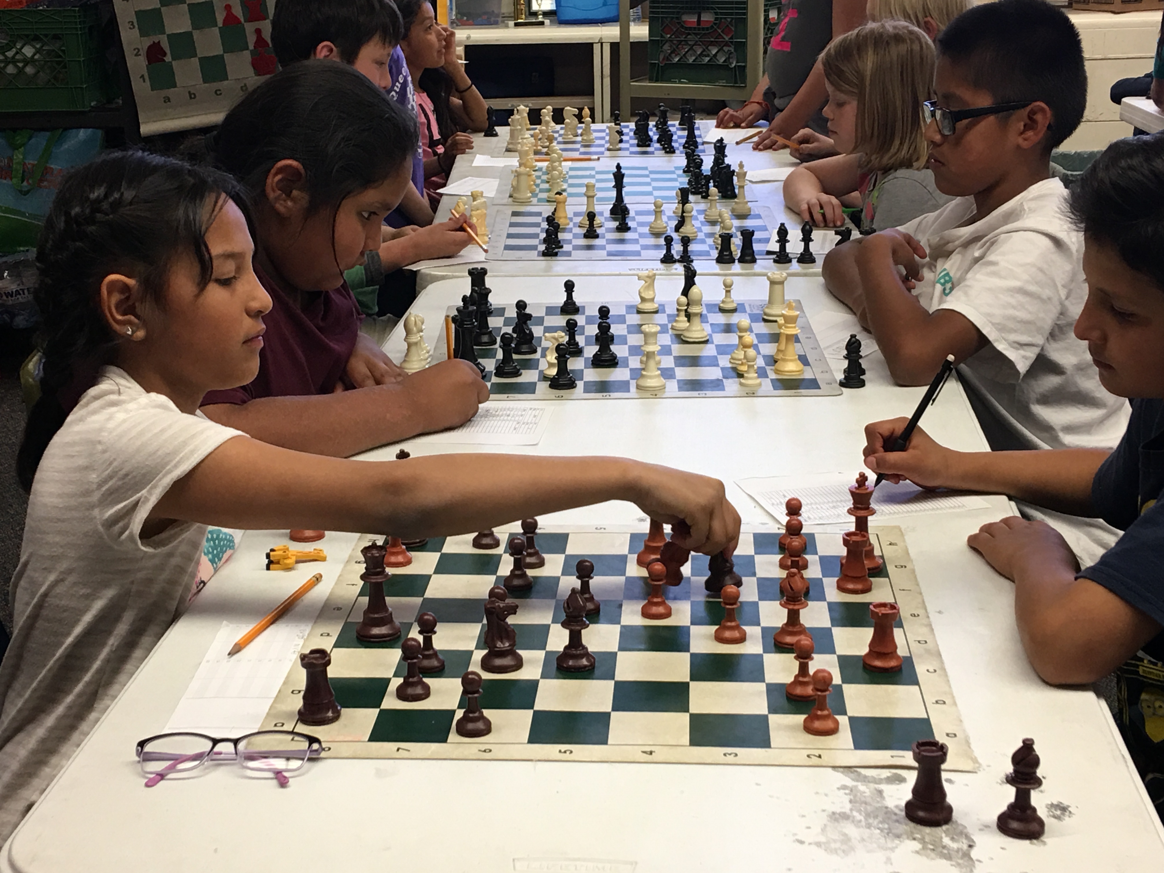 Killip Elementary third-graders Alexa Cardenas, left, and Luis Gonzalez, right, are preparing for the chess SuperNationals. (Photo by Laurel Morales/Fronteras)