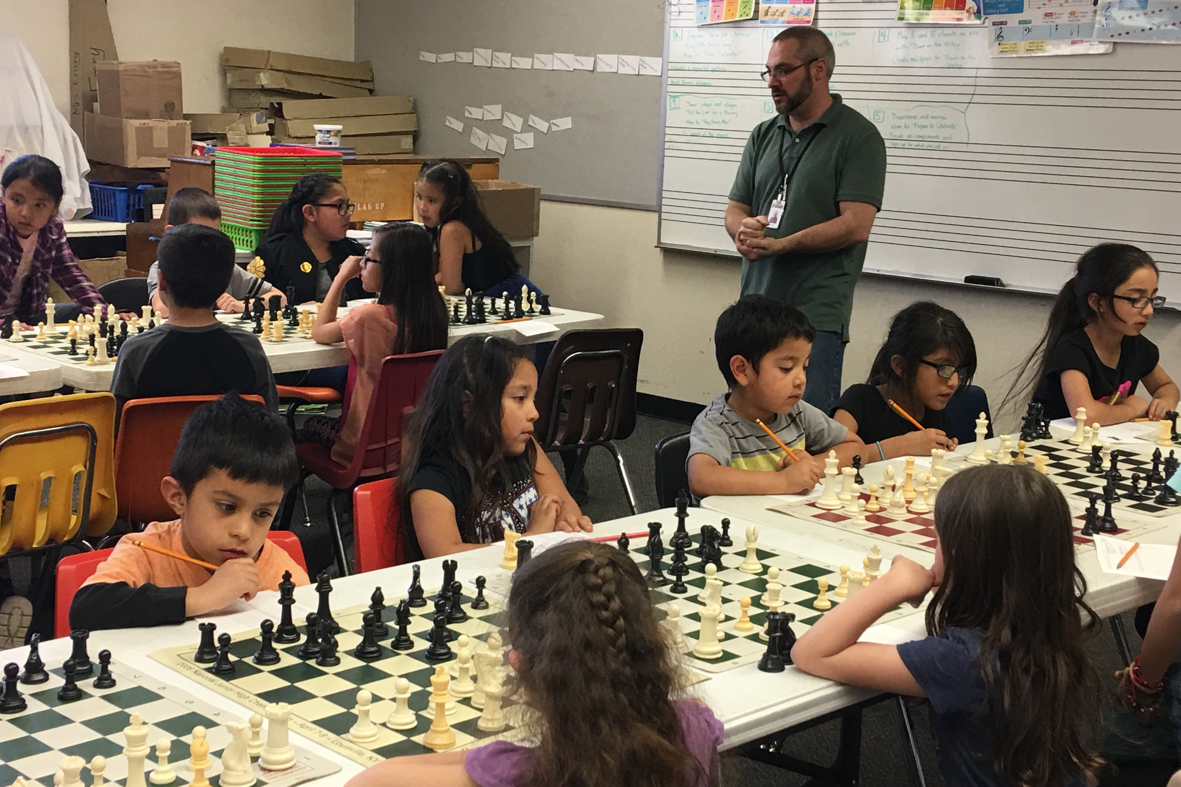 Coach Ted Komada motivates his chess team in preparation for the SuperNationals of chess, this week in Nashville, Tenn. (Photo by Laurel Morales/Fronteras)