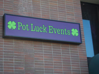 The sign outside Pot Luck Events, located at 420 W. 3rd Avenue in downtown Anchorage. (Photo by Zachariah Hughes/Alaska Public Media)