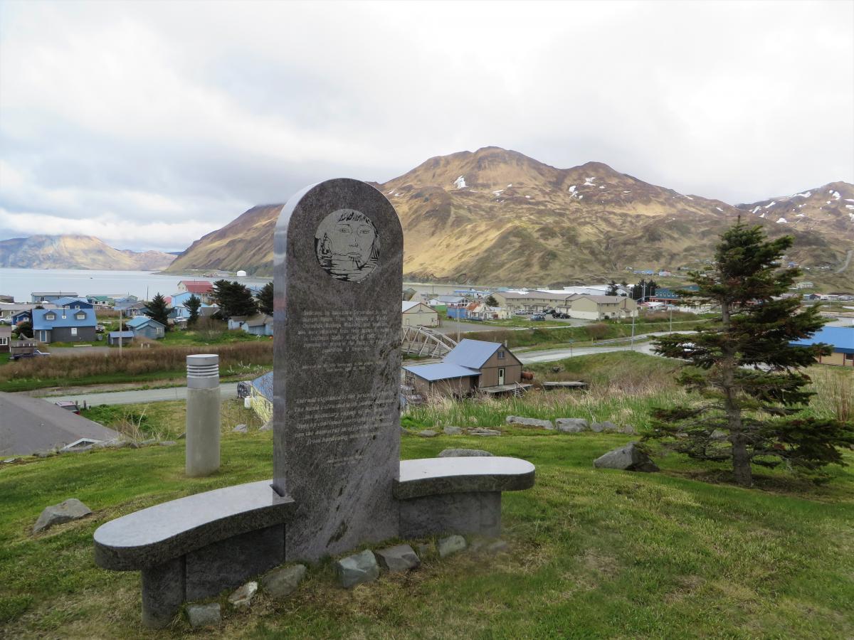 A memorial overlooking downtown Unalaska is dedicated to the Unangax who were forcibly evacuated during WWII and the Aleutian villages that were never resettled. (Photo by Laura Kraegel/KUCB)
