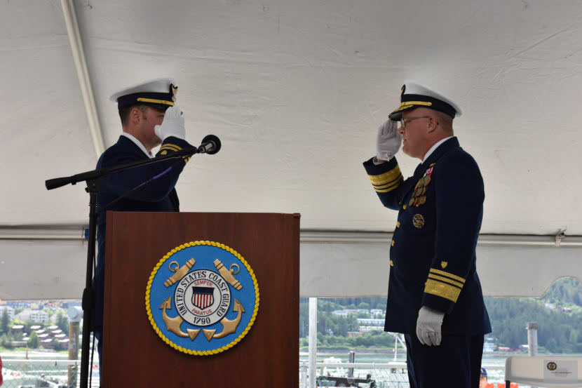 Lt. Frank Reed, commanding officer of the Coast Guard cutter Bailey Barco, salutes Vice Adm. Fred Midgette, Coast Guard Pacific Area commander, as the vessel is officially commissioned into the Coast Guard during a ceremony in Juneau on June 14, 2017.