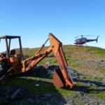 A backhoe awaits dismantling at the summit of Mount Juneau in 2009.