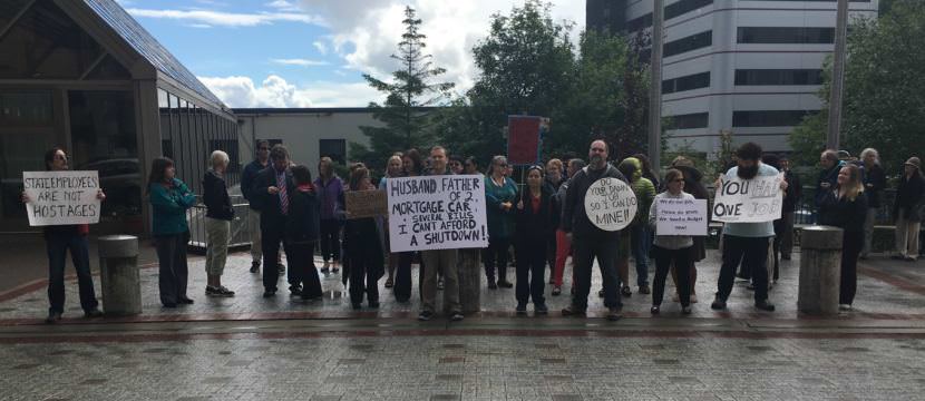 State workers protested a possible government shutdown outside of the Capitol, June 22, 2017. The House and Senate appeared close to a budget compromise to avoid the shutdown. (Photo by Andrew Kitchenman/KTOO and Alaska Public Media)