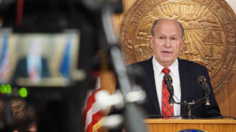 Alaska Gov. Bill Walker discusses a compromise budget package with reporters in the cabinet room of the Capitol in Juneau on June 6, 2017. (Photo by Jeremy Hsieh/KTOO)