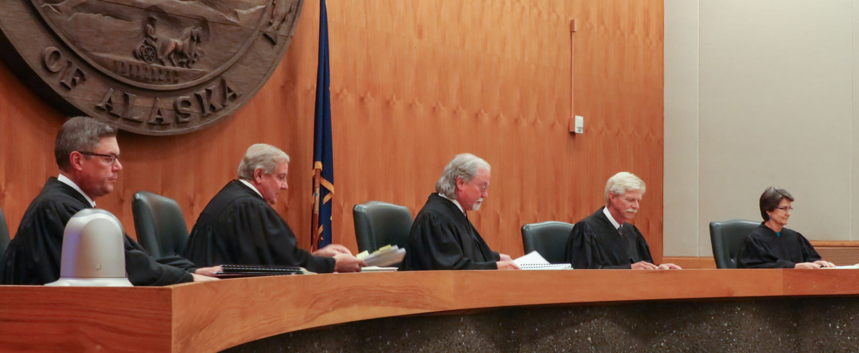 The Alaska Supreme Court hears arguments in the Boney Courthouse in Anchorage on June 20, 2017, in a case that seeks to overturn Gov. Bill Walker's veto of about half of Alaska Permanent Fund dividend money last year. Pictured from left to right: Justices Joel Bolger, Daniel Winfree, Craig Stowers, Peter Maassen and Susan Carney.
