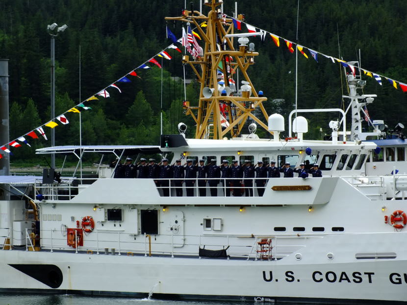 Ship's crew salute during commissioning of USCGC Bailey Barco in Juneau June 14, 2017.