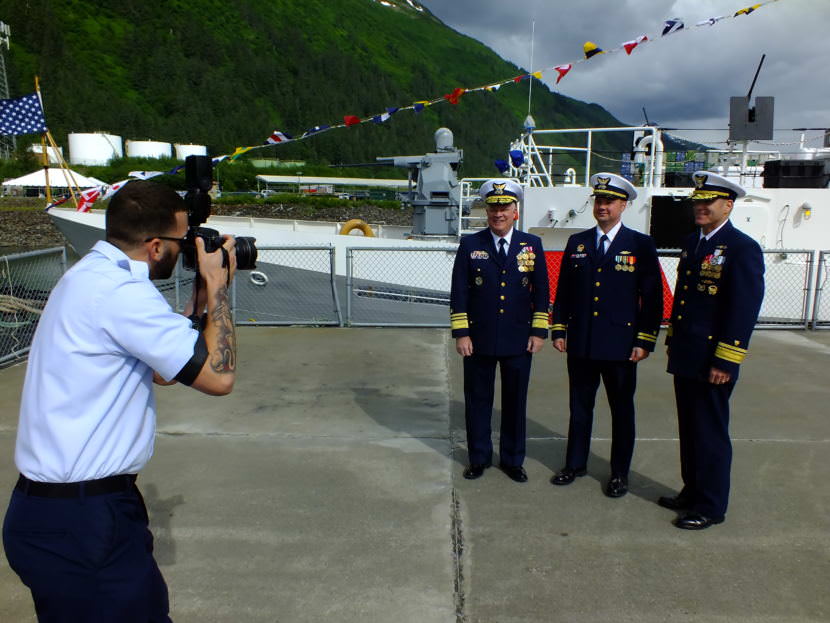 Vice Adm. Fred Midgette, commander of the Coast Guard's Pacific area (far left in group), Lt. Frank Reed, commanding officer of the cutter Bailey Barco (center), and Rear Adm. Michael McAllister, commander of the Coast Guard's 17th District (right) get their picture taken after a commissioning ceremony in Juneau on June 14, 2017.