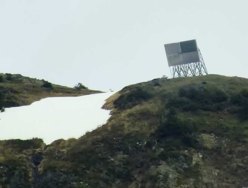 Telephoto view of the AT&T Alascom microwave reflector on Mt. Juneau as seen from North Douglas.