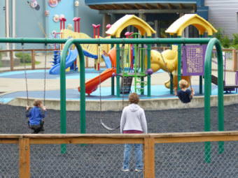 Juneau kids play on the playground in front of Harborview Elementary School on Wednesday.