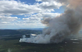 The North Robertson Fire burning about 2 miles west of the Alaska Highway near milepost 1350 is now estimated at 800 acres. (Photo by Tim Whitesell/Alaska Division of Forestry)