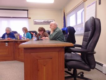 Mike Case’s seat was empty at the April 26 aAsembly meeting. Also pictured: Mayor Jan Hill, Clerk Julie Cozzi, Assembly members Margaret Friedenauer and Ron Jackson. Friedenauer resigned from her position Wednesday, May 31. (Photo by Emily Files/KHNS)