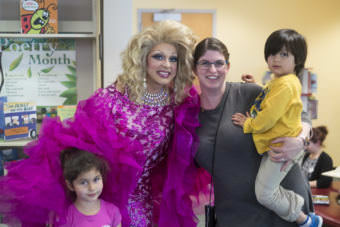 Gigi Monroe poses for pictures with Stacy Katasse and her children Autumm and Kaash. (Photo by Annie Bartholomew/KTOO)