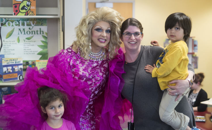 Gigi Monroe poses for pictures with Stacy Katasse and her children Autumm and Kaash. (Photo by Annie Bartholomew/KTOO)