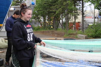 Maddy Marinkovich learned to stitch nets from her father. (Photo by Caitlin Tan/KDLG)