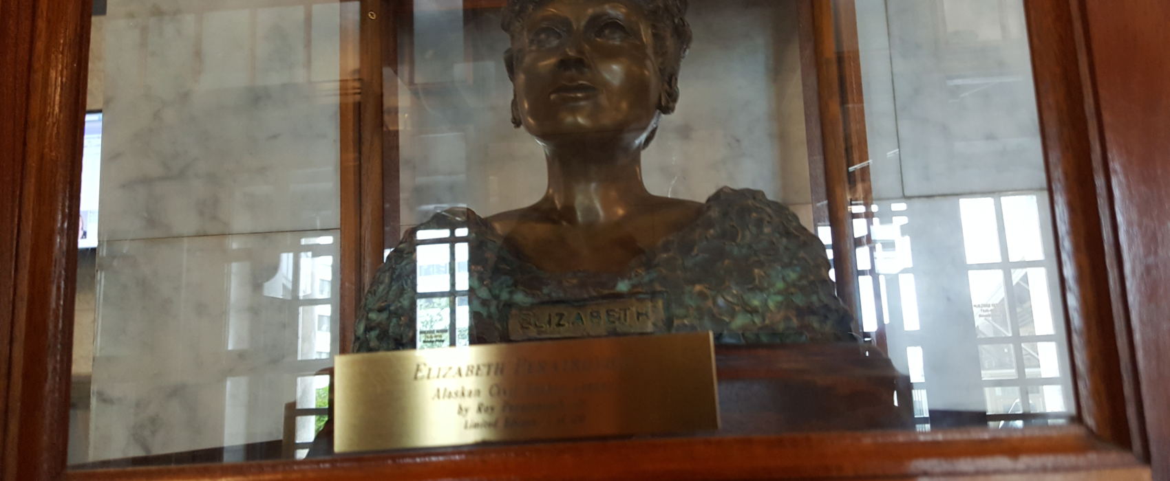 A bust of Alaska Native civil rights leader Elizabeth Peratrovich greets capitol visitors in the front lobby of the Alaska Capitol building. (Photo by Tripp J Crouse/KTOO)