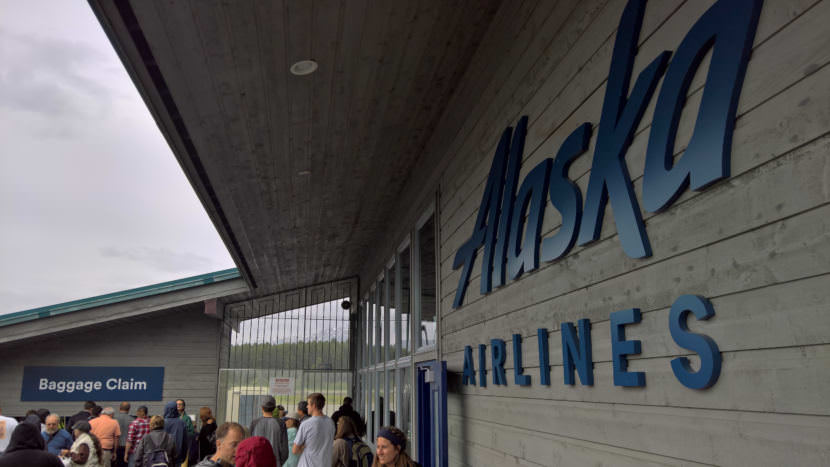 Alaska Airlines passengers wait for their bags at Gustavus Airport on June 29, 2017. (Photo by Jeremy Hsieh/KTOO)