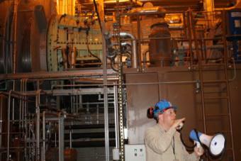 Plant Superintendent Nat Lewis shows off one of Plant 2A’s new turbines.