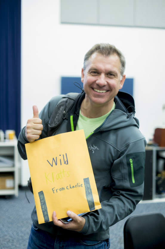 Chris Kratt holds an envelope of gifts from Charlie and Anna Begenyi backstage after Meet The Kratts, Wild Alaska Live Meet & Greet at Thunder Mountain Auditorium. (Photo by Annie Bartholomew/KTOO