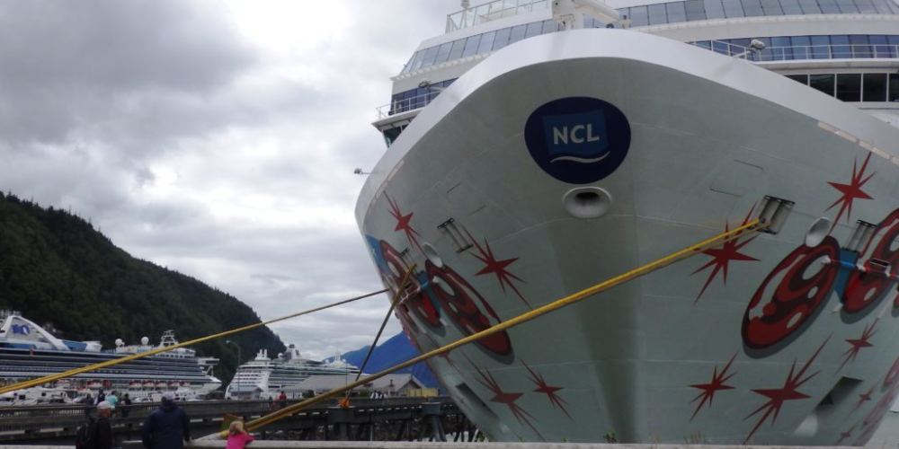 The Norwegian Pearl tied up at Skagway’s Broadway dock in July 2017. Two more cruise ships are moored at the railroad dock in the background. (Photo by Emily Files/KHNS)