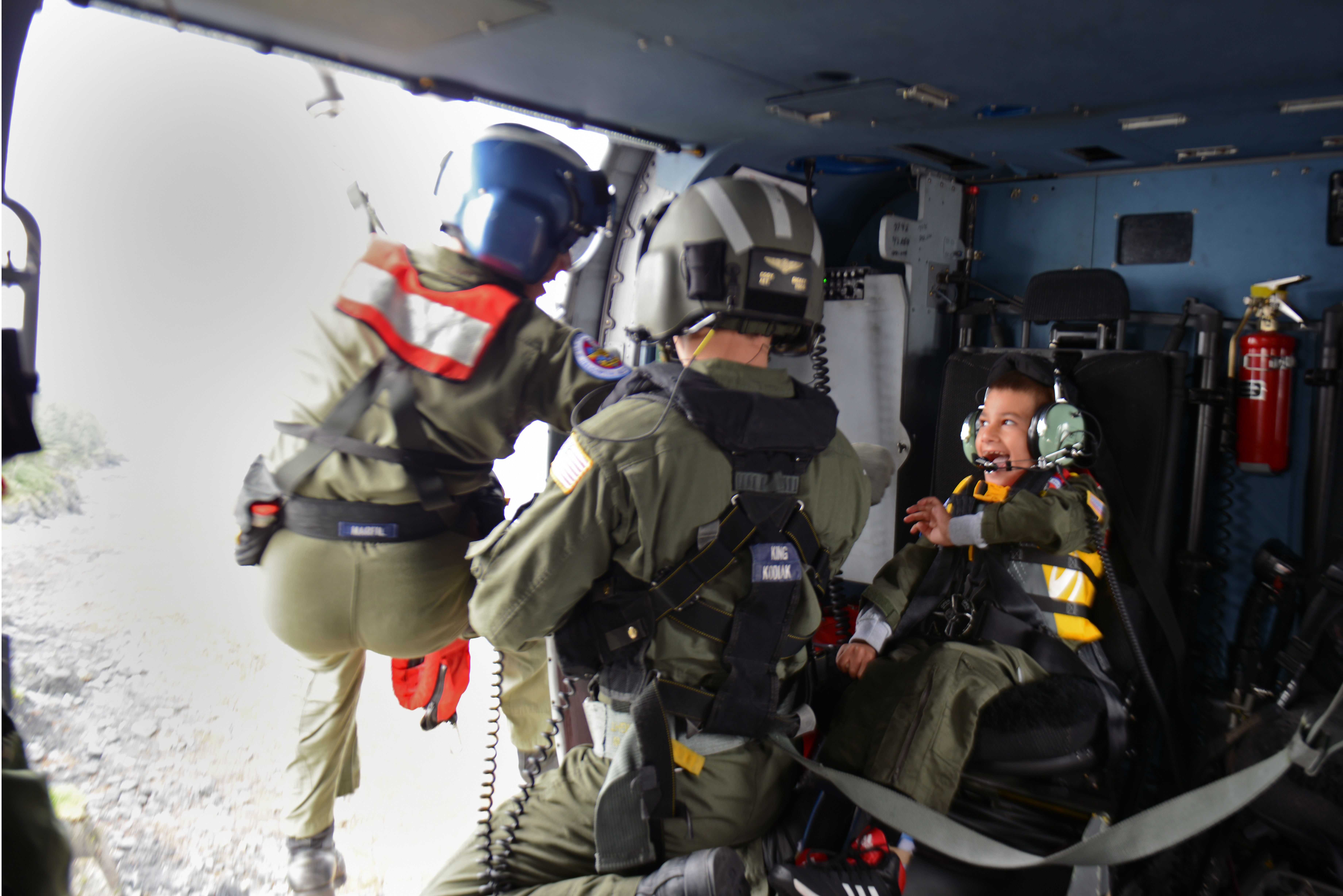 Andrew Bishop, 8, right, was named an honorary petty officer third-class by the U.S. Coast Guard Air Station Kodiak as part of his Make-A-Wish to be a rescue swimmer. (Photo by Meredith Manning/USCG)