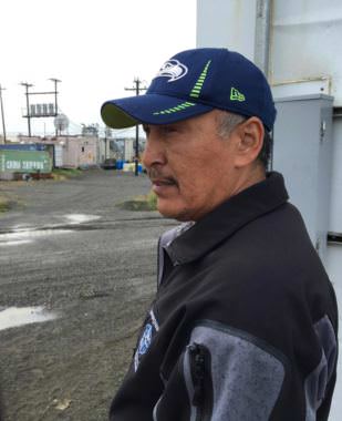 Warren Jones, the CEO of Qanirtuuq Inc., surveys Quinhagak’s defunct processing plant. (Photo by Teresa Cotsirilos/KYUK)