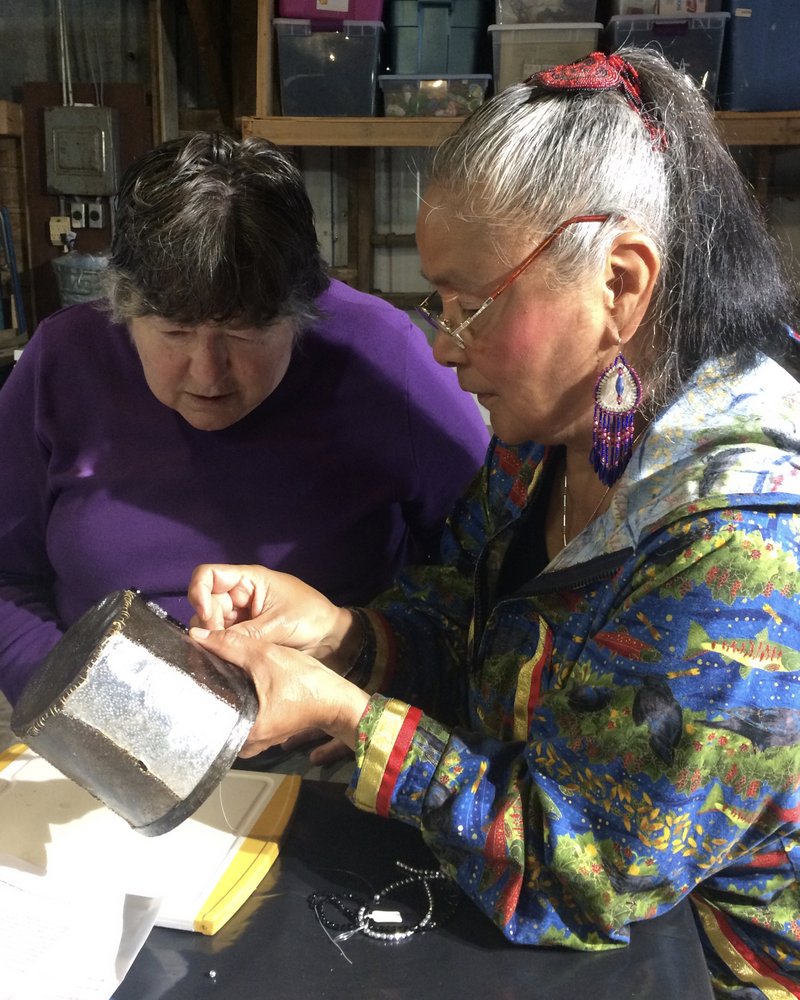Athabascan artist Audrey Armstrong leads a class at the Sitka Arts and Science Festival on how to weave fish skins into traditional Athabascan-style baskets. (Photo by Sarah Gibson/KCAW)