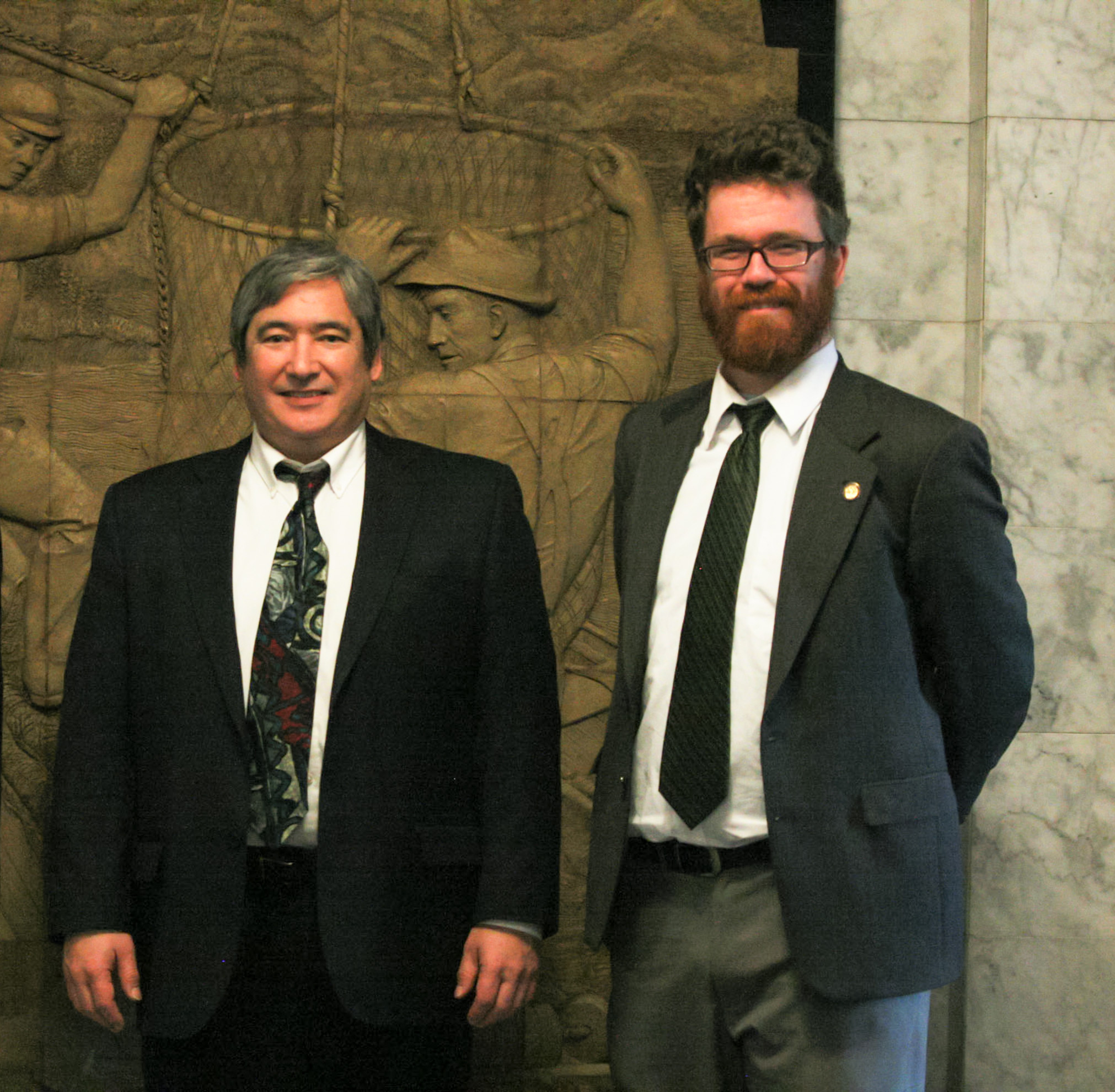 Rep. Sam Kito III (D-Juneau) and Rep. Justin Parish (D-Juneau) stand in the Capitol in February. They both say the Legislature accomplished some good in the legislative session, but has more work to do. (Photo courtesy office of Rep. Sam Kito)