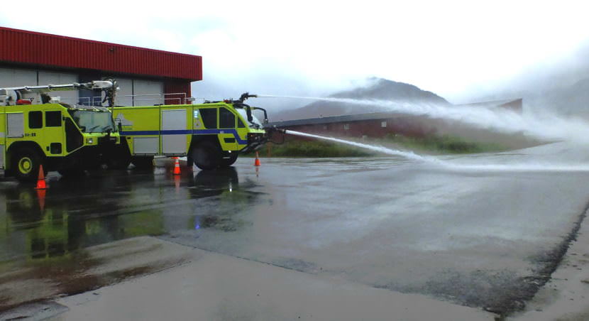 The newest ARFF vehicle at the Glacier Valley Fire Station carries 3,000 gallons of water, 400 gallons of foam, and 500 pounds of dry chemical which it can spray with two hose nozzles mounted on the front of the vehicle.
