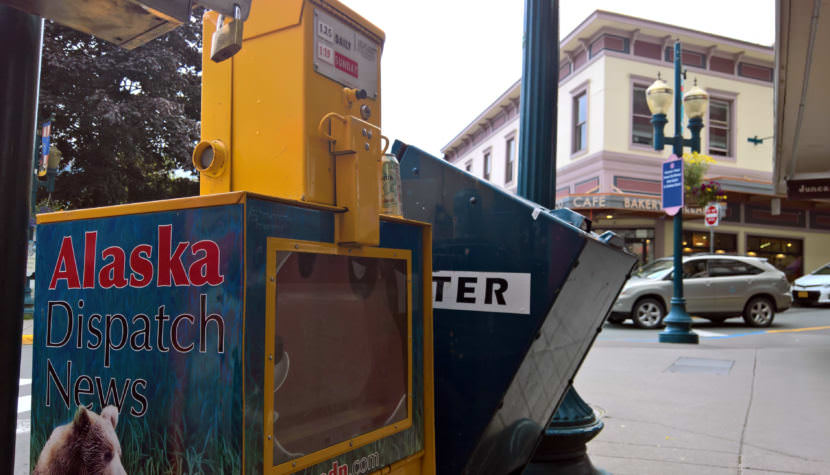 The sidewalk near the corner of Front and Seward streets has one of the few Alaska Dispatch News vending machines in Juneau. Pictured Aug. 14, 2017.