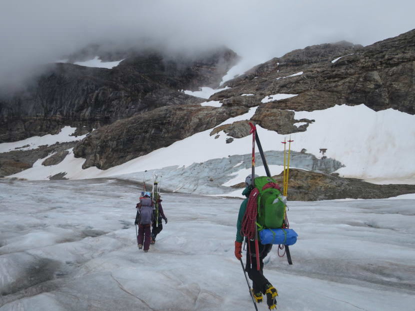 Students Zach Gianotti, Theresa Westhaver, and Ilana Casarez crossing the blue ice at the terminus of the Lemon Creek Glacier before a hike up Nugget Ridge. (Photo by Bryn Huxley-Reicher, courtesy JIRP)