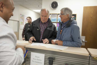 Alaska Gov. Bill Walker and Lt. Gov. Byron Mallott file for re-election on Monday, August 21, 2017, at the Division of Elections in Juneau, Alaska. The two are filing as unaffiliated candidates -- though Mallott maintains his personal affiliation with the Democratic party. (Photo by Rashah McChesney/Alaska's Energy Desk)
