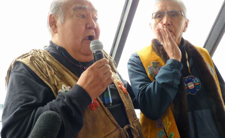 Paul Marks. right, and David Katzeek speak in Tlingit and English during a recent tour of traditional T’aaḵu Kwáan lands. (Photo by Ed Schoenfeld/CoastAlaska News)
