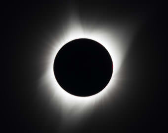 A total solar eclipse is seen on Monday, August 21, 2017 above Madras, Oregon. A total solar eclipse swept across a narrow portion of the contiguous United States from Lincoln Beach, Oregon to Charleston, South Carolina. A partial solar eclipse was visible across the entire North American continent along with parts of South America, Africa, and Europe. (Public domain photo by Aubrey Gemignani/NASA, via Wikimedia Commons)