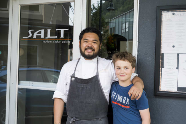 Chef Lionel Uddipa and Chopped Jr competitor Denali Schijvens stand outside of Salt on Aug. 10, 2017. Schijvens and Uddipa have been cooking together since Denali was 8. (Photo by Annie Bartholomew/KTOO)