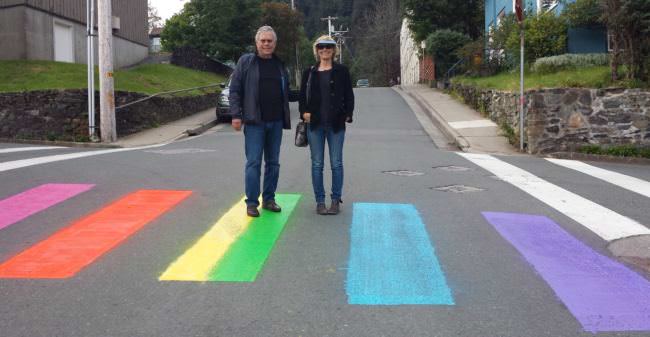 An unidentified couple pose for the recently painted rainbow crosswalk at the intersection of 7th and Gold streets in August 2016. (Photo courtesy Sue Warner)