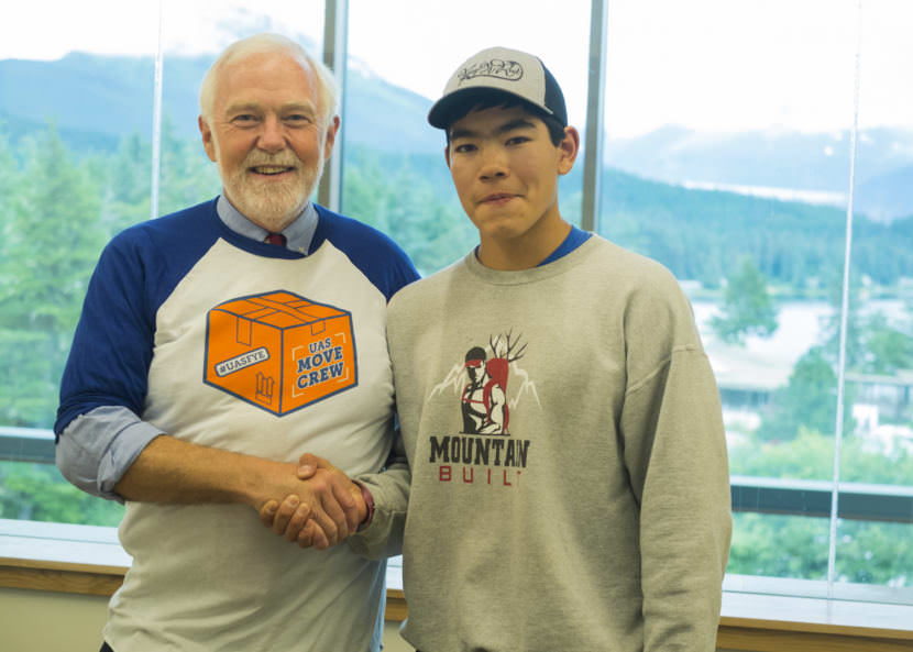 UAS Chancellor Rick Caulfield poses with incoming freshman Triston Chaney from Dillingham who is pursuing his undergraduate degree in Marine Biology this semester. (Photo by Annie Bartholomew/KTOO)