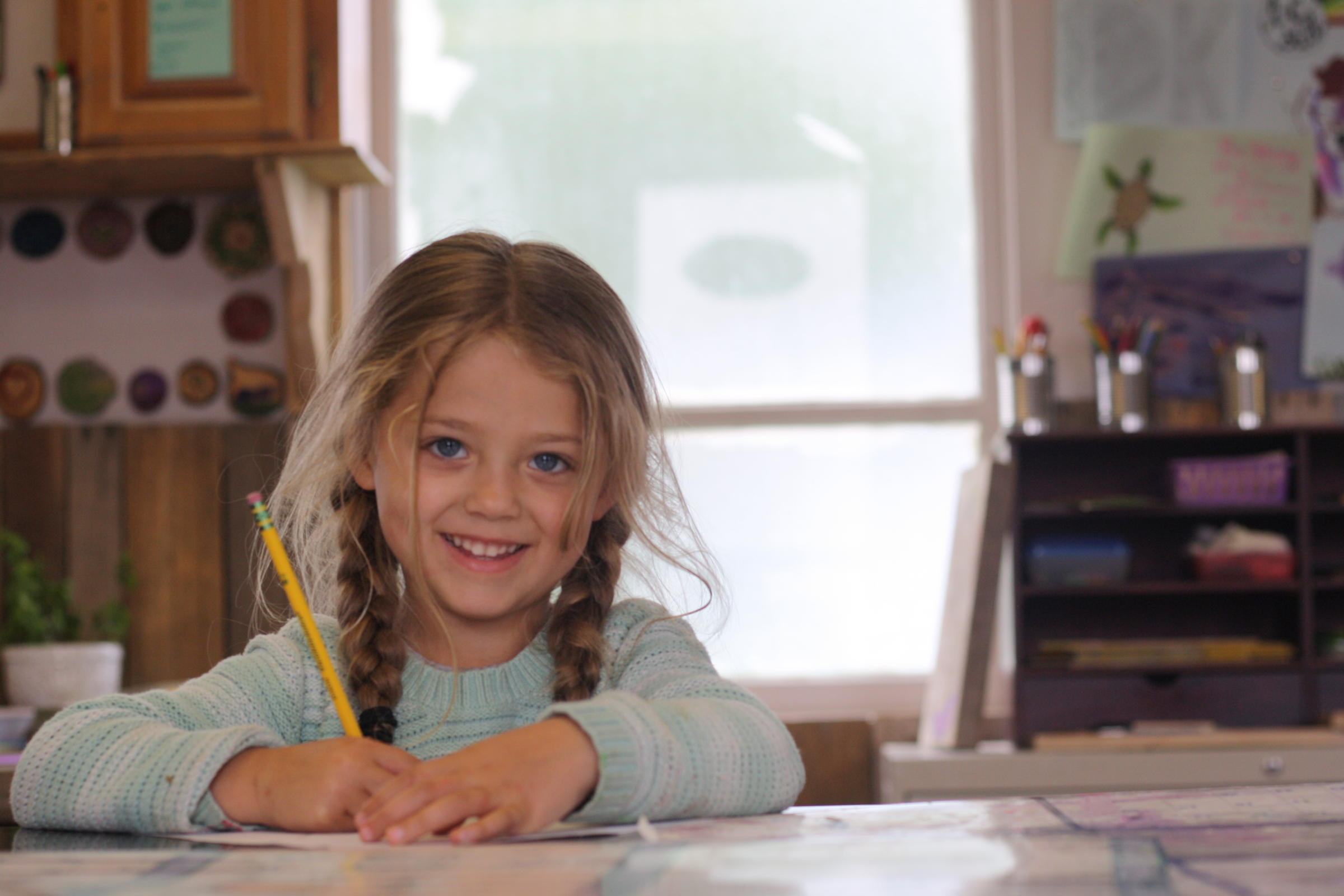 Mischaell Romo, 4, lives in the same building as the Dillingham Christian Youth Center. She’s familiar with many of the youth who spend time there, and she’s always looking for someone to draw, paint, or color with. (Photo by Zoey Laird/KDLG)