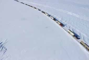 Sagavanirktok River flooding halted trucks en route to the North Slope oil complex several times in spring and summer 2015, creating long backups at points along the Dalton Highway. (File photo by KUAC)